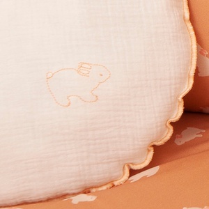 Kissen rund Mulltuchstoff RABBITS bestickt orange 30cm